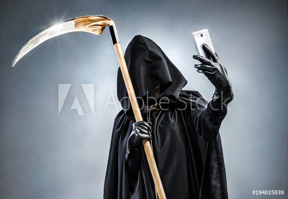 Grim Reaper making selfie photo on smartphone. Photo of personification of death wielding a large scythe in silhouette.